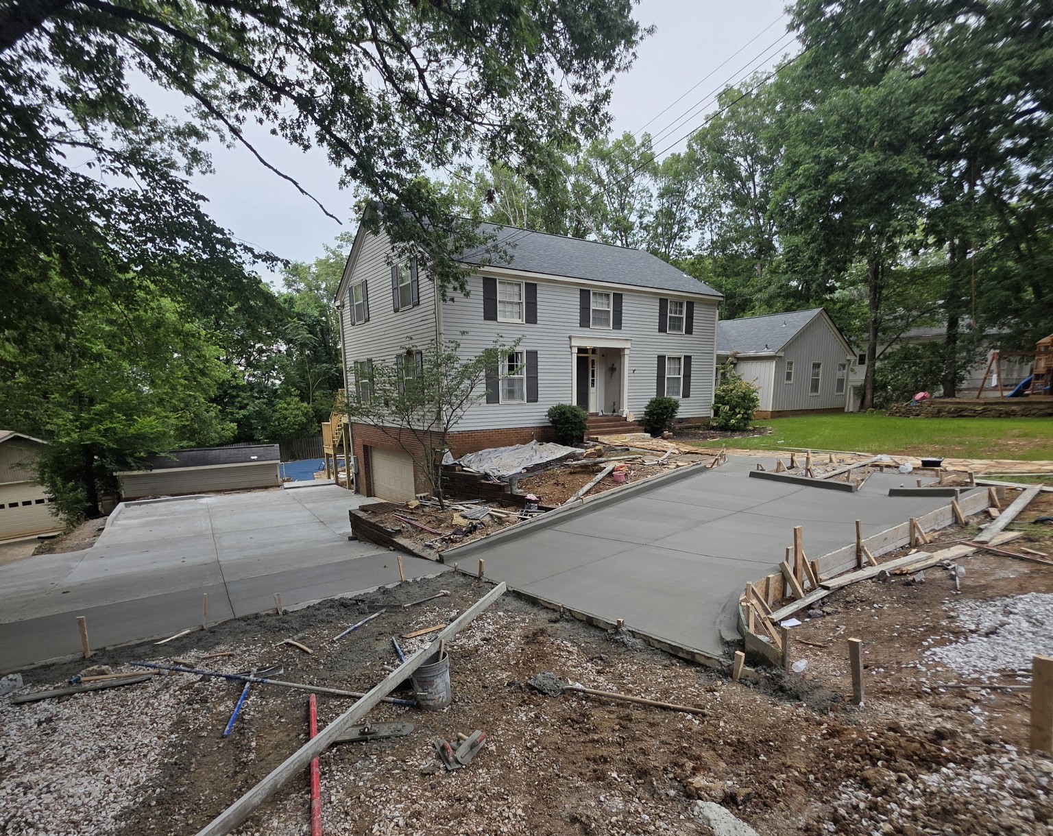 Wide view of the custom concrete driveway project during construction