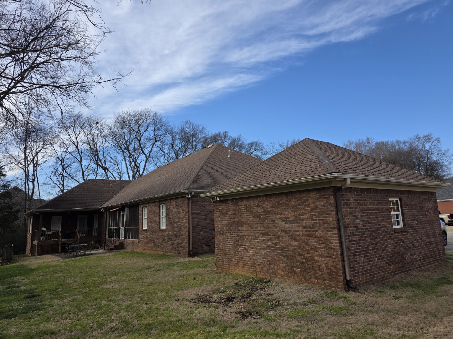 Rear elevations and detached garage before roof replacement
