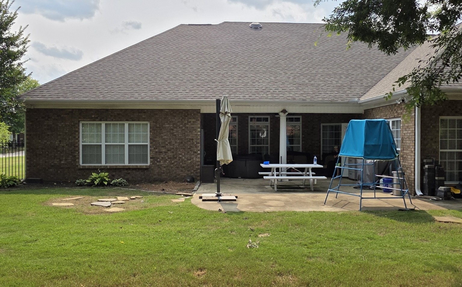Small original backyard patio before the covered porch addition
