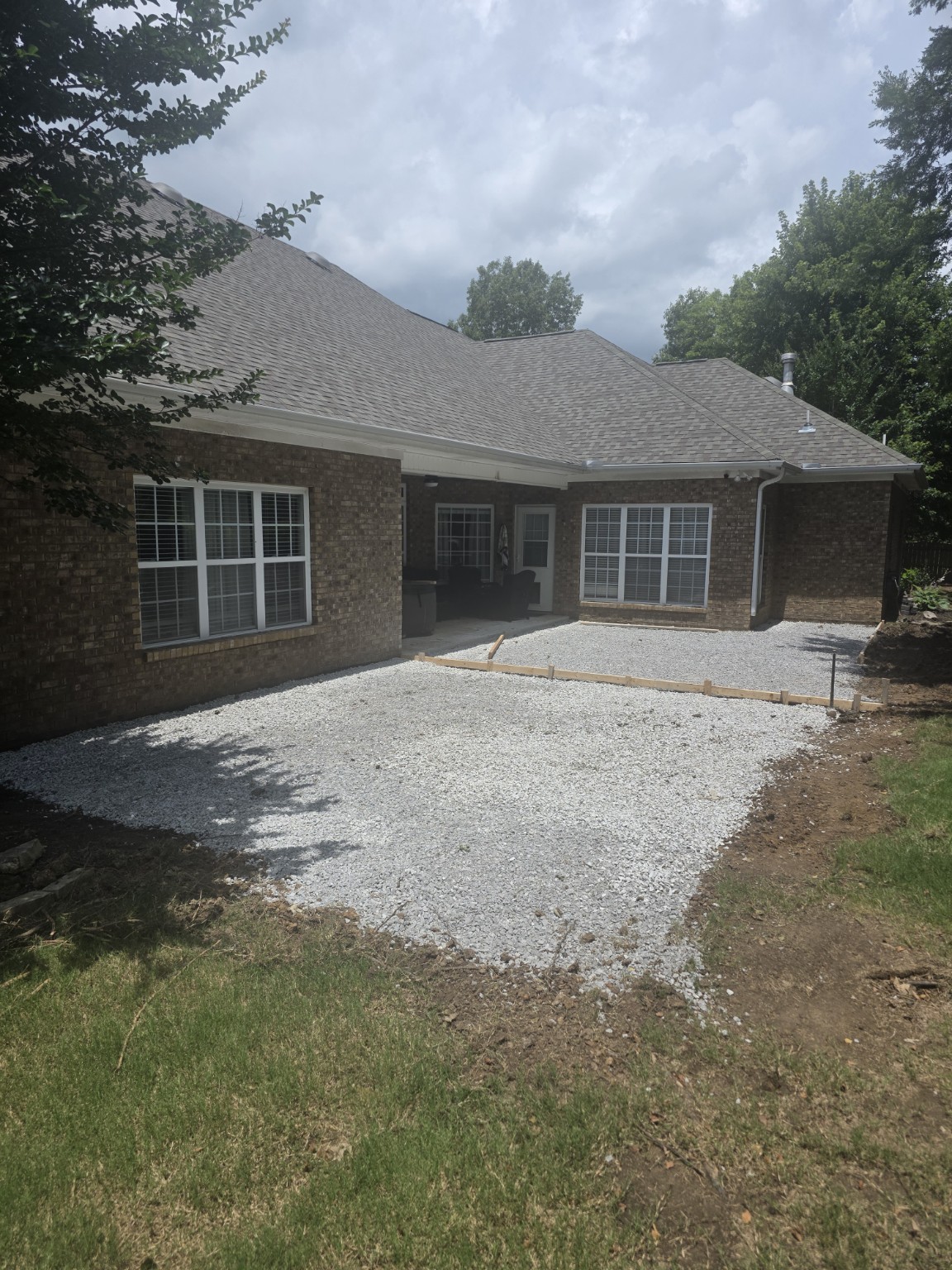 Prepared and expanded patio base during construction